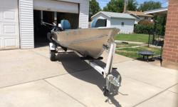 14ft Lund aluminum fishing boat,with 8hp mercury motor,24lb. Minkota electric motor, eagle fish finder,one down rigger pole holders,2 padded swivel seats.and trailer
