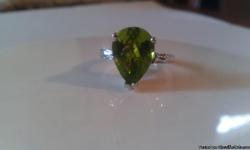 14 kt white gold ring w/ 4.04 ctw pear shape natural Burma peridot gemstone.