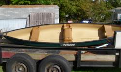 This canoe seats 3, with cup holders, rod hlders. The seat in the middle is a stoage bin/cooler. Heavy duty handles.&nbsp;In nice condition&nbsp;