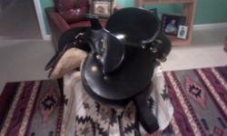 16" black leather western saddle with Australian poleys used only a few times. Perfect condition. This saddle is super secure - great for trail riding. The saddle fit my Arabian but has also been used on a Quarter horse. Can send pictures. Asking $200,