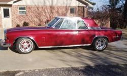 Has 289 engine V-8, major restoration, Auto, air conditioning, red and white interior