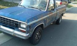 1984 Blue Ford Ranger Truck - manual transmission - rusted on the outside but runs great. Has had the engine re-built. New tires.