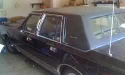 1988 Lincoln Town Car. (Same model used by McConaughey in the movie "The Lincoln Lawyer").
69231 miles. Black leather interior. Driver side armrest needs to be replace. Car will almost start but will not completely turn over. Probably an inexpensive fix