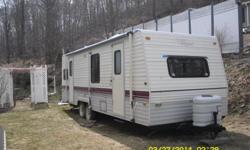27rg terry resort travel trailer remodeled inside and roof replaced 2013 inspected&nbsp;untill july 2015&nbsp; hot water tank replaced with a removable electric 2.5 gal tank for easy storage.Propane stove,electric/propane fridge.new flooring,rear bedroom