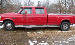 Hello I got a 1997 Ford F350 4 Door Dually Crew Cab 2 wheel drive, Red, Real Clean Truck, 5 Speed, 7.3 Turbo Power Stroke Diesel, 150 mi. , Gooseneck Hitch, Bed Rails, Receiver Hitch, Cloth interior, Heat and AC works good, Cal. Hood, Power windows, doors