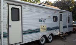 For sale is a nice clean 27' Hornet by Damen travel trailer. Every thing works and it can be towed by a half ton pickup. It has a double bed in the front, a single in the back and the table and couch fold into beds.