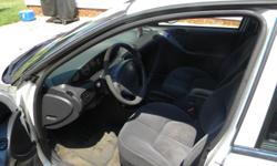 White, 4 door, automatic, Black cloth interior, AC, automatic locks and windows, runs great. I repaired a lot recently so that I could sell it. I loved it but I am want a newer car. Feel free to call or email me if you have questions.
