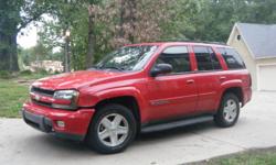 Chevrolet 2002 Trailblazer LTZ SUV. 6-cyl. Auto. Opt. 4-wheel dr. Red w/gray interior. Power windows. 6-disk CD. Front/rear air cond. Dual/side airbags. Keyless entry. Compass. Heated mirrors. Heated seats. Leather interior. Pwr. locks. Pwr. seats. Tilt