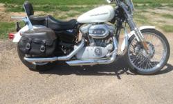 2005 Harley 883 Custom. Glacier white pearl color. Anti-theft alarm. Windshield. Engine guard. Leather saddle bags.Less than 12,000 miles. Always kept inside. Everything works on this bike. Located in Olton, Texas. Text me at 806-638-1427.