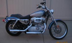 2005 Harley Davidson XL883C Sportster
Screamin Eagle Exhaust and Air Cleaner, Stainless Steel Braided Clutch, Throttle and Front Brake Line, 3 inch Handle Bar Riser, forward controls, Memory Foam Seat done by Mean City Cycle, extremely smooth and easy