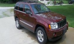This is a loaded 2007 Jeep Grand Cherokee Limited. Options include 5.7 Hemi, heated leather seats, sunroof, remote start, 6-disc CD changer, navigation system, garage door opener, automatic dual climate control, tow package, and satellite radio. This