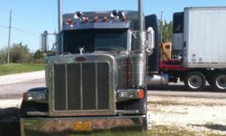 Peterbilt 2003
379 exhd
915,575
333 rears
18 speeds
Single turbo 550 cat
Leather
Owner op gauge kit
Fridge factory
Factory surround
80% rubber lp 24/5's virgin no caps.
578040 Vin
100% brakes
Dual ss air cleaners
Dual ss exhaust
320" wheelbase
Tag weight