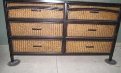 Beautiful quality made 6 drawer dresser from Pier 1 Imports. Dresser is heavy and has a wicker/metal look to it. Dresser drawers gulide open and shut-one of the drawers is sticky. I paid $695 for the dresser originally.