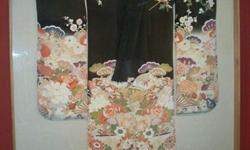 Beautifully colorful Japanese kimono, professionally framed. Approximately 75 years old. Real gold threads within the floral pattern.