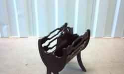 This is a very old Antique Magazine Rack, asking $50.00 Excellant condition. if interested please call Angie -- to see.