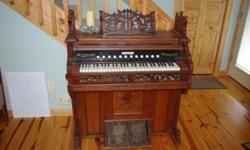 Solid Oak, small chapel size, all parts work. Made by Lakeside, Chicago, Illinois, around 1907. Was shipped to Scotland and back to the US. Pump bellows work and fretwork is in good condition. phone 828-817-5574 days only.