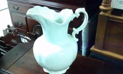 This is an old White Pitcher that dates back to the 1844's from the Goodwin Pottery Co. Semi-Porcelain. A little about the Mfg. John Goodwin, East Liverpool, founded his factory in 1844. This piece is marked 1844 (he died 1875), it is from his early