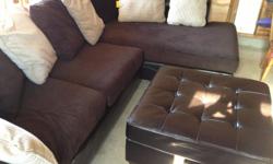 This is a like new, chocolate Ashley sectional with an oversized&nbsp;matching ottoman. It is a suede and leather mix and made&nbsp;very well. Paid 1200.00 less than a year ago. It has&nbsp;been in storage for the past 3 months. It has Scotchguard. OBO