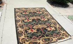 Capel / (style)-Edenton, (size)- 5' by 8', (color)- 300/Black, 100% Wool. It really is a beatiful rug. NEVER BEEN USED!! EVER!!! If interested please feel free to call me (727) 849-9351. And i'm VERY Negotable!!!!