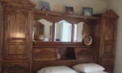 Queen size, large headboard with mirror & cabinets, dresser to match, like new. Can email photo if requested.