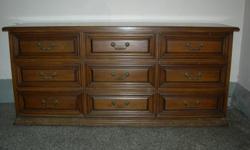 A bedroom set including armoire, dresser (9 drawer), 2 night stands with drawers and shelf, and queen head board. Solid wood, walnut finish, well maintained.