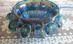 26 piece princess iridescent blue carnival glass punch bowl set, still in the original box.&nbsp; $300.00&nbsp;&nbsp; 12 cups, 12 holders, bowl and one lattle.&nbsp;&nbsp; Please put punch bowl in subject line.&nbsp;