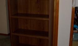 Walnut 5 shelf book case, top shelf has mirror (W30, H70, D12)
Call Bill or Sandy (813)645-3538822bd