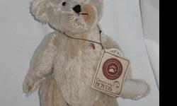 Teddy B. Bear (Event) plush Boyds Bear
Mohair cream-colored bear
style #5004 it says in Boyds Tracker book, #50004 it says on hang tag
approximately 10 inches high
issued 2001, retired 2001
Comes with hang tag
In great condition and displayed in a