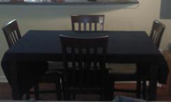 Brown Bar Height Dinette Set with 4 Chairs. $125 price negotiable. Square Style perfect for moderate size apt or eat in kitchen. Call 770-633-2787 for more information.