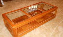 Slighttly Used! Oak/3 panel glass coffee table with 2 tiers, 4 roller legs for easy moving. Perfect for living room, family room, or den. Best offer (25W x 55L) clean home, no pets, or kids, email for details.
