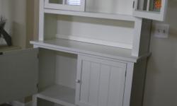 Buffet with Hutch. Distressed shade of off white, wainscot detailing on doors. Buffet table has two doors and an open shelf. Buffet table measures 42x15x36''H. Hutch measures 42x11x33"H. Asking $180. Contact Janice at () -.