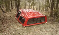Fiberglass camper shell. Fits 1/2 ton trucks.
Front and 2 side glass/all sliding. Double latch on rear hatch.
Front starts even with cab and angles up to about 6".
Red. 202-326-3100 Conway, AR.