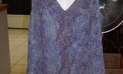 Casual Corner Annex sleeveless silk shirt in fantastic condition. Size is XL. Has flowered/paisley pattern with ruffle around collar and down front. Has zipper on one side.
