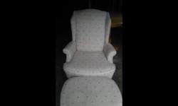 White chair with delicate print on it and Ottoman for sale. In perfect condition, no rips or tears, solid pieces. Asking $50.