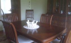 Beautifuly detailed formal dining room table with 6 side chairs and 2 armed chairs. Double carved pedestle base with roping detail.