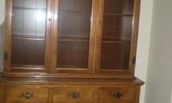 Solid maple china cabinet and hutch.&nbsp; 52" wide, 79" high and 19 1/2" deep.