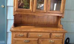 Beautiful solid maple china hutch with glass doors.&nbsp; 1950's model excellent shape.&nbsp; Jackie --