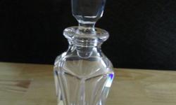 Beautiful perfume bottle with mirrored top. In fantastic condition. Bottle is not marked. Measures approximately 6 inches tall and 2 inches wide.