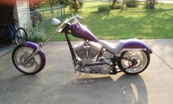 2004 Rolling Thunder Frame Raked 42degrees plus another 4 degrees in the triple trees, 12" over on the front fork tubes, custom purple metalflake paint with a pearl coat on top, 18" low profile 250 rear tire & 21" front tire. 100" Rev-Tech motor with