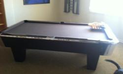 Custom made pool table by Empire, Serial number 2190. Ball Return.&nbsp; Included are two sets of balls, cues and rack.