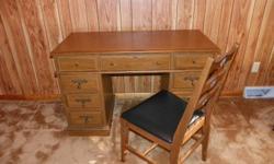 Wood desk measures 22" wide and 46" long, It has 6 drawers, 1 drawer is file drawer, chair has black cushioned seat, Fantastic condition, great for any room or office