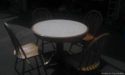 Ashley Furniture Dinette Set
Round Table with four chairs
Oak table with tile top & chairs are light oak to match table.
Sturdy and in good shape.