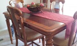 Beautiful warm cinnamon color inlaid dining set, pub heights, 8 chairs, makes into a perfect square when leaf is in.&nbsp;60"x60" Excellent condition.&nbsp; Paid $2500.&nbsp;
