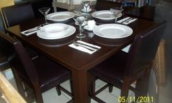 Nice espresso/cappuccino colored solid wood tables and chairs. Set includes (1) high-top,or pub style table and (4) bar stools. I have (8) sets left. They were in my restaurant. They are all in very good condition, willing to work better price if you buy