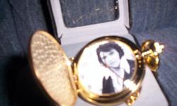 Elvis Presley pocket watch brand new with case and chain gold Quartz movement yoy open it up and Elvis picture is on the dial.