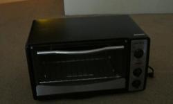 Euro Pro Convection oven in like new condition. This was a wedding present and was only used once. Black in color with three control knobs.