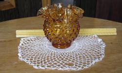 Amber hobnail glass vase in perfect condition. 4 inches high by 4 3/4 inches across at the ruffled top.
Will ship anywhere in Montana for $7.50 plus $1.75 insurance