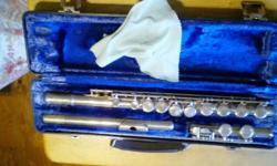 Nickle-plated flute with case that is in very good condition even though it is 25 years old. &nbsp;Comes with a relair kit but it doesn't need it. &nbsp;Would be good for band at all levels. Call between 8-5 Weekdays.