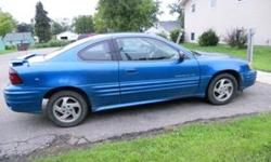 2 dr coupe, blue, 133 k, powerlocks/windows, grey cloth interior, rear spoiler, great car and very reliable.