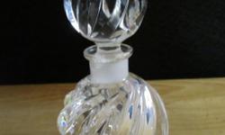 Beautiful spiral-shaped perfume bottle in great condition. Has original stopper. This is not marked, but looks and feels like Waterford. Stopper has a slight flaw inside of the glass, as shown in photo 2. Measures approximately 5 1/4 inches tall to top of